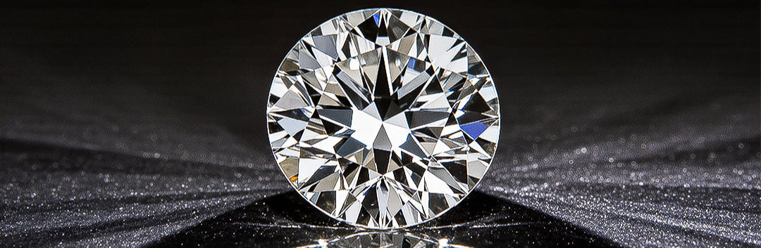 Round diamond on a reflective black surface with a dark background