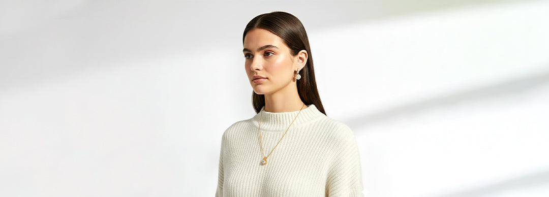 Woman wearing a white sweater with a blurred background