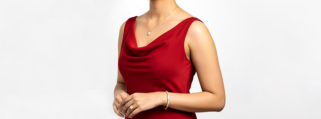 Woman wearing a red sleeveless top on a plain background