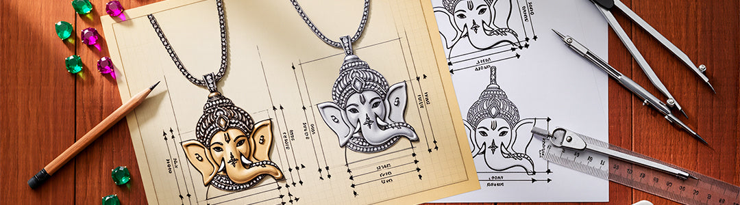 Ganesha pendant design on paper with drafting tools on a wooden surface