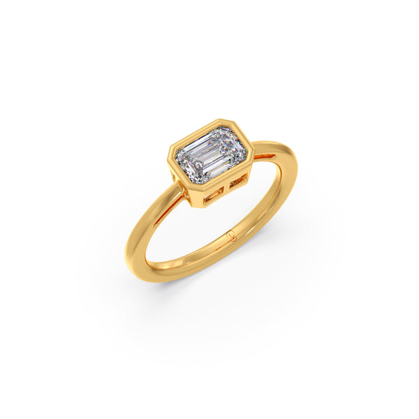 Gold ring with a diamond on a white background