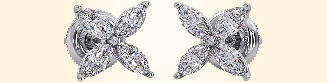 Pair of diamond earrings on a beige background