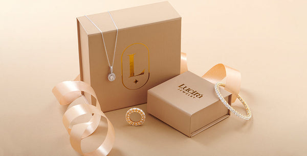 Jewelry set with necklaces and earrings on a beige background